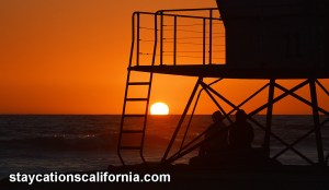 Lifeguard tower and people W logo