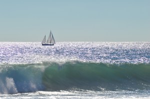 Sailboat waves in forground